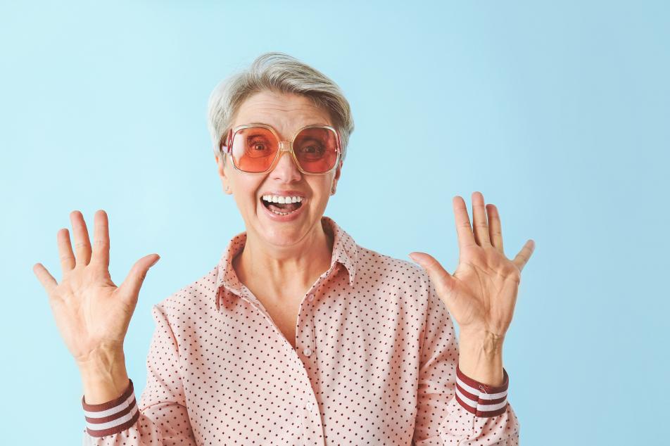 Lady with glasses hands in the air